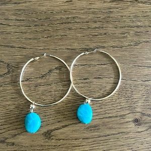 Gold hoop earrings with faux marble stone charm